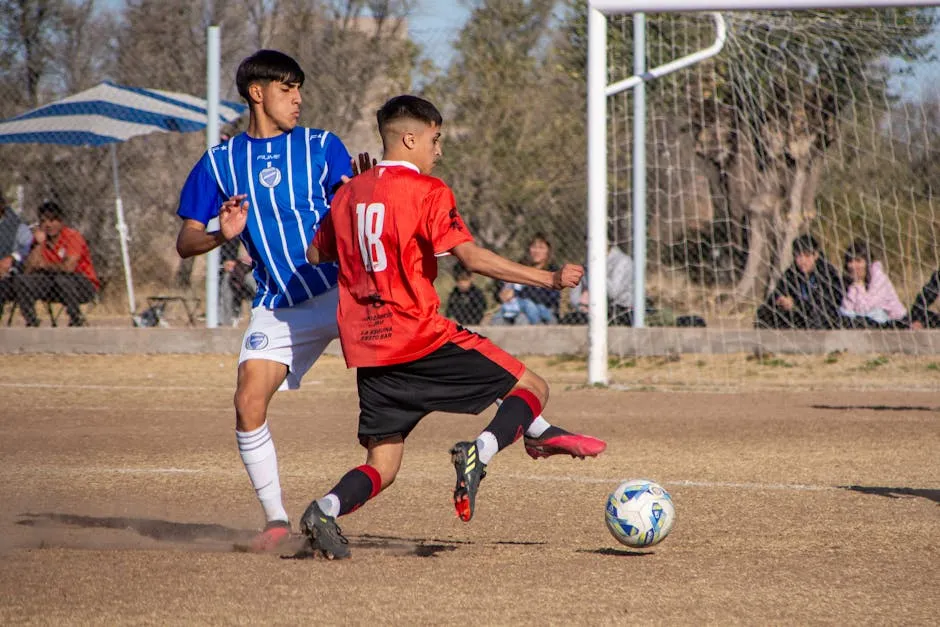 Two players compete fiercely in a soccer match, showcasing action and energy on the field.
