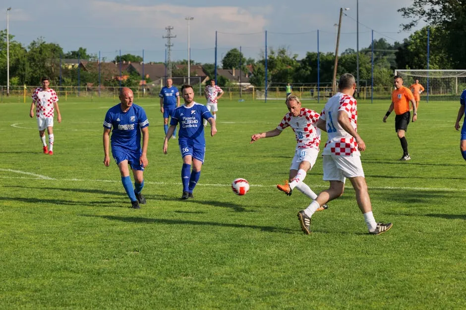 Dynamic action of a soccer match in Garešnica, Croatia showcasing teamwork and sportsmanship.